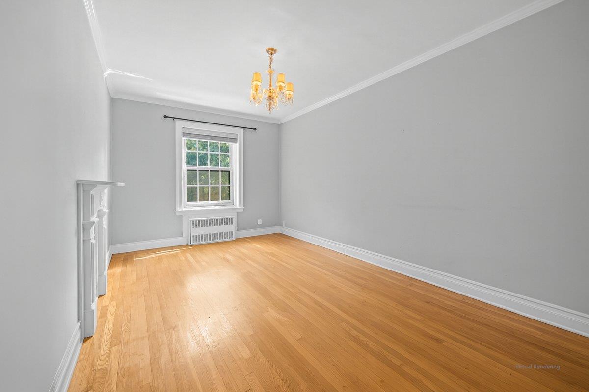 525 West 238th Street, Unit 1L Bronx, NY 10463 - Photo 13 of 20 a view of an empty room with wooden floor and a window