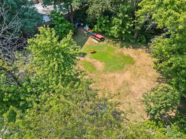 a aerial view of a house with a garden