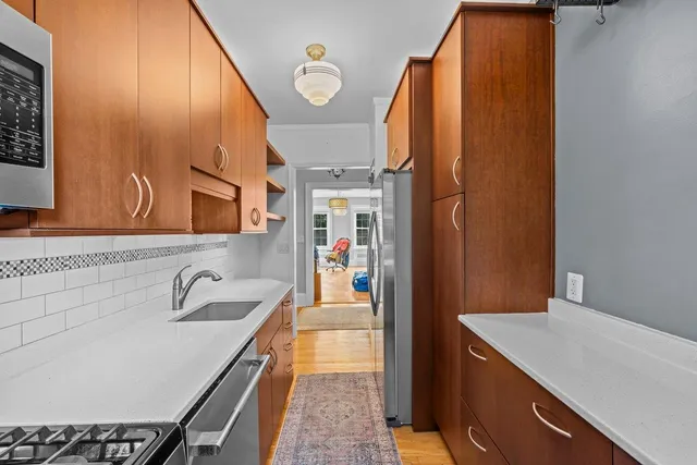 a bathroom with a sink a bathtub and a mirror