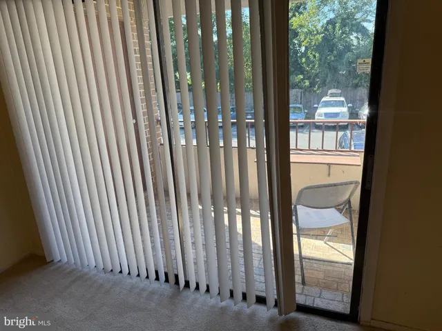 a view of a glass door and the balcony