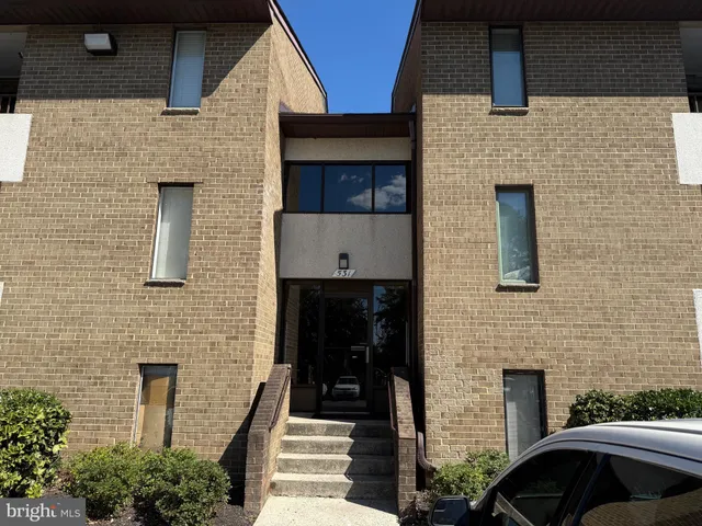 a front view of a house with stairs