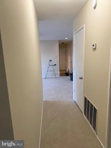 a view of a room with a hallway