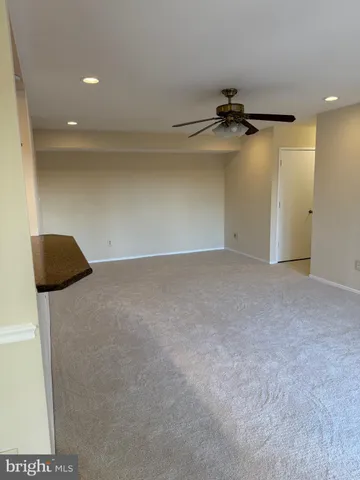 a view of a livingroom with a refrigerator