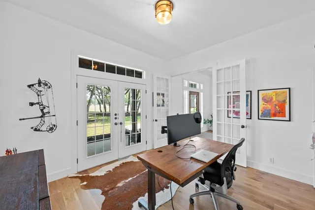 a workspace with furniture window and wooden floor