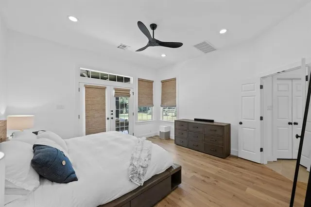 a bedroom with a bed and window