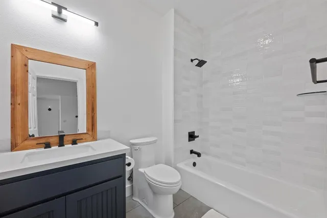 a bathroom with a toilet a sink and a bathtub