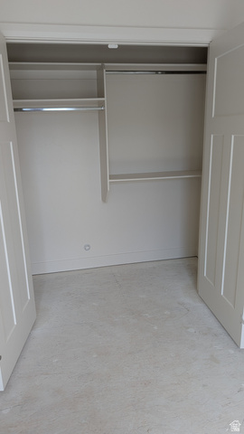 26063 North 8800th West Portage, UT 84331 - Photo 8 of 9 Closet with double bi-fold panel doors, interior shelving, and chrome hanging rods