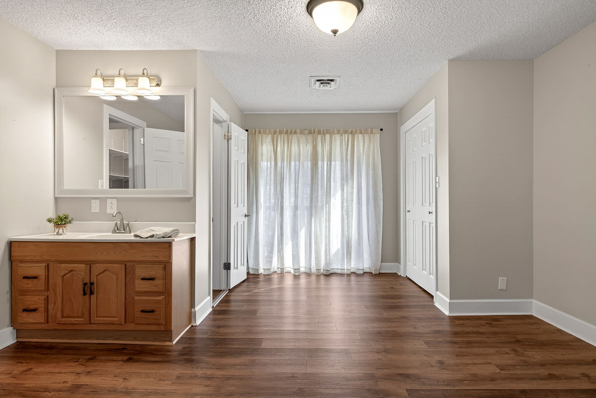 1003 Hodges Ferry Road Sparta, TN 38583 - Photo 19 of 49 an empty room with wooden floor and cabinet