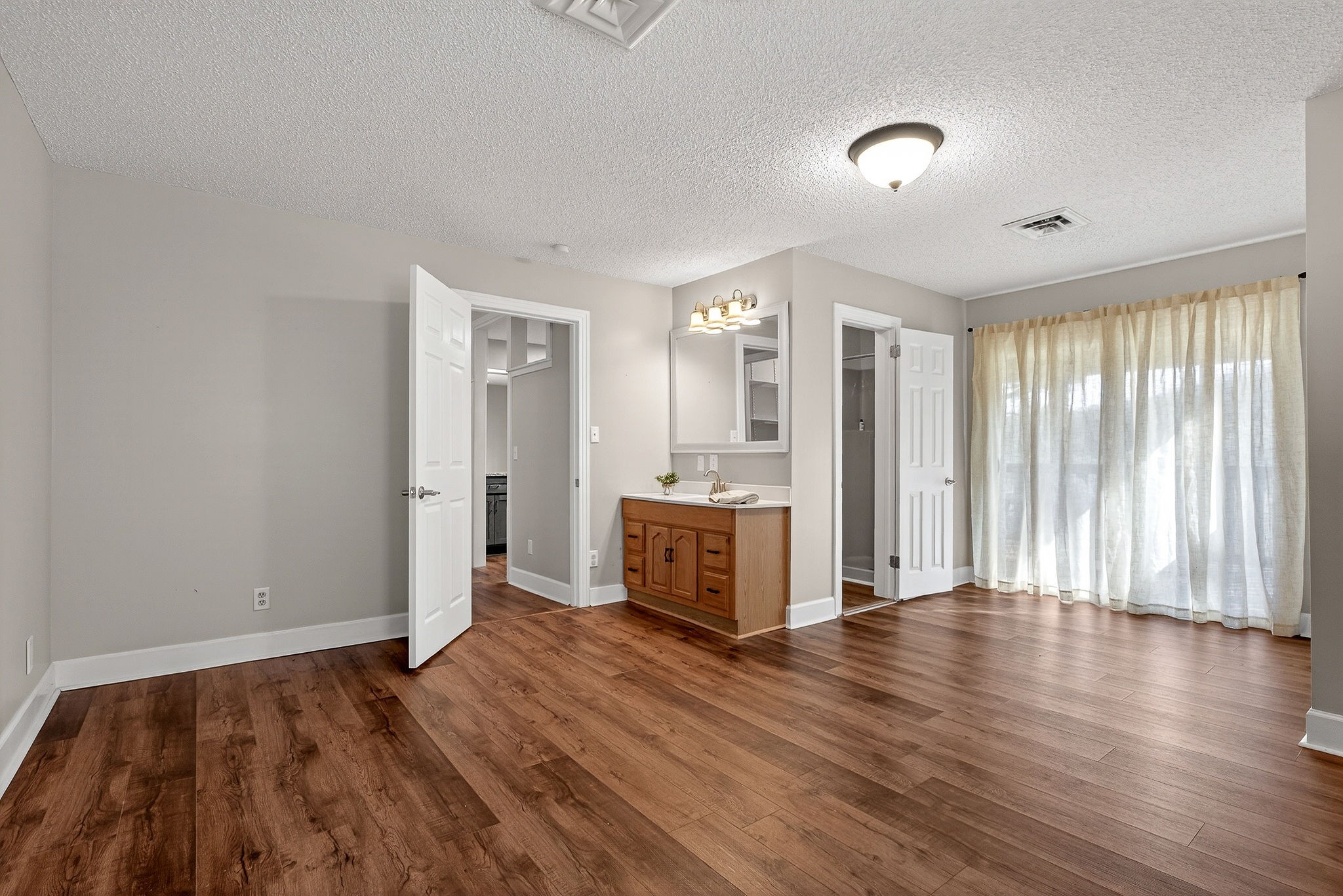 1003 Hodges Ferry Road Sparta, TN 38583 - Photo 20 of 49 an empty room with wooden floor and windows