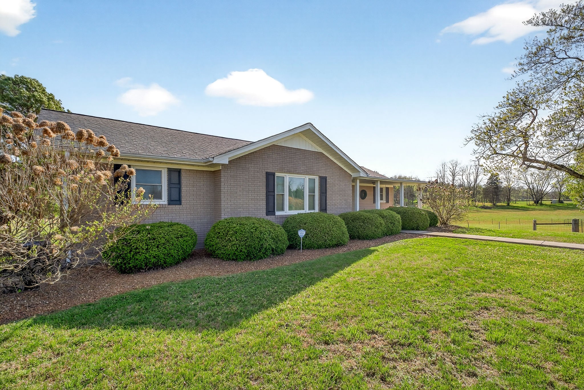 1003 Hodges Ferry Road Sparta, TN 38583 - Photo 3 of 49 a view of a house with a big yard and potted plants