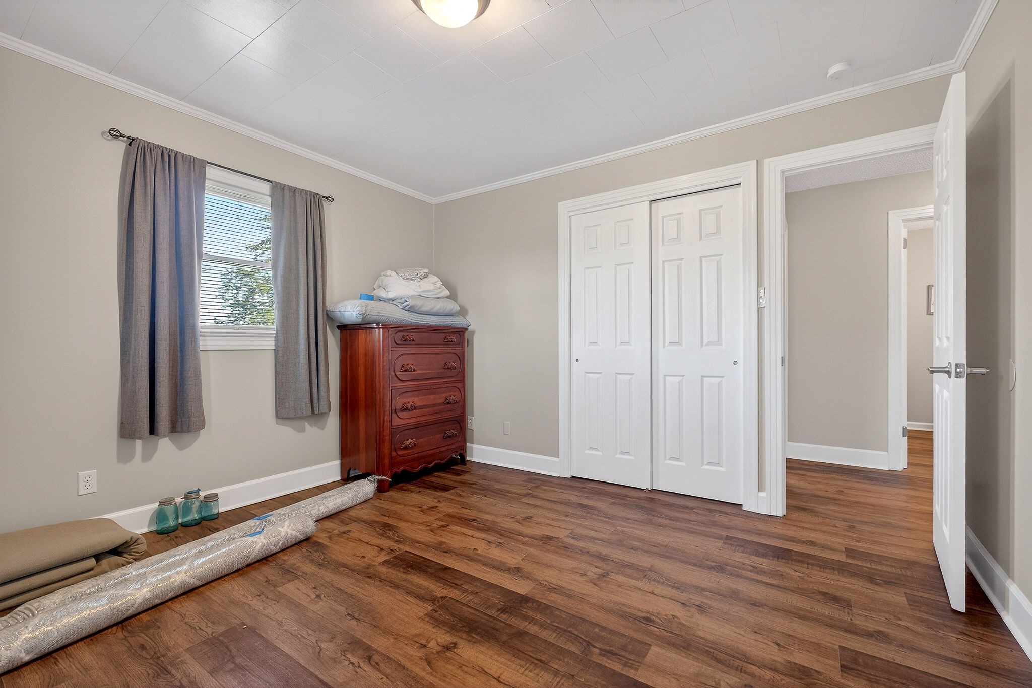 1003 Hodges Ferry Road Sparta, TN 38583 - Photo 37 of 49 a view of an empty room with wooden floor and a window