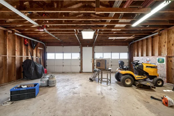 a view of parking garage with cars