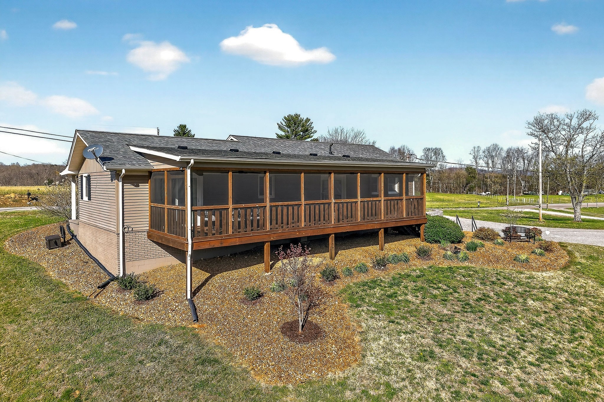1003 Hodges Ferry Road Sparta, TN 38583 - Photo 49 of 49 a view of a house with a backyard and a garden