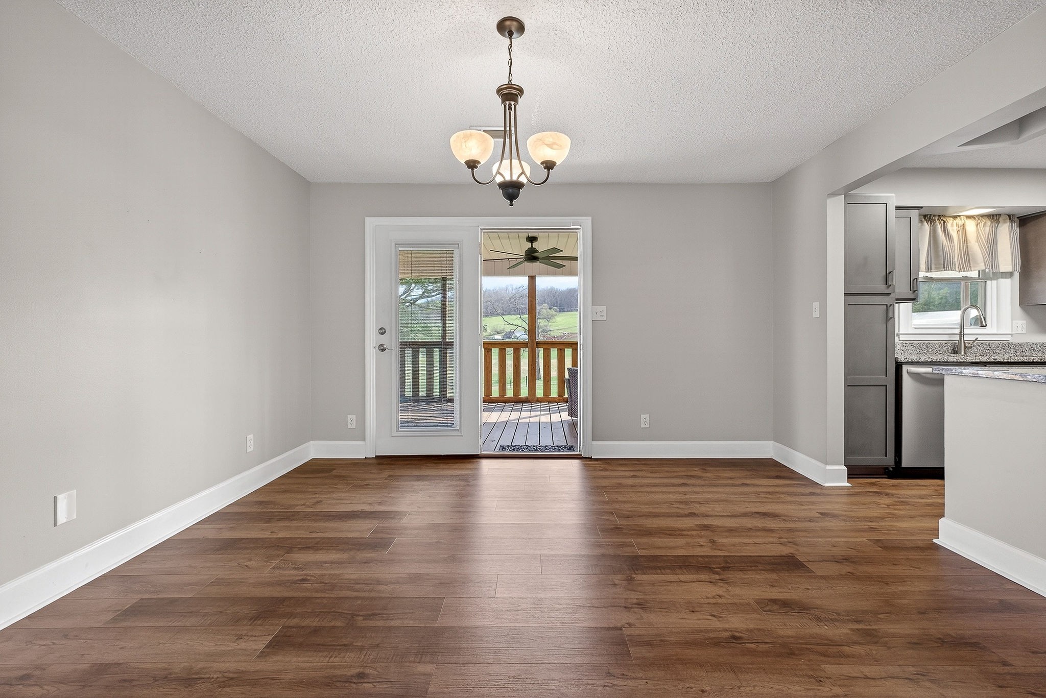 1003 Hodges Ferry Road Sparta, TN 38583 - Photo 9 of 49 a view of an empty room with window and wooden floor