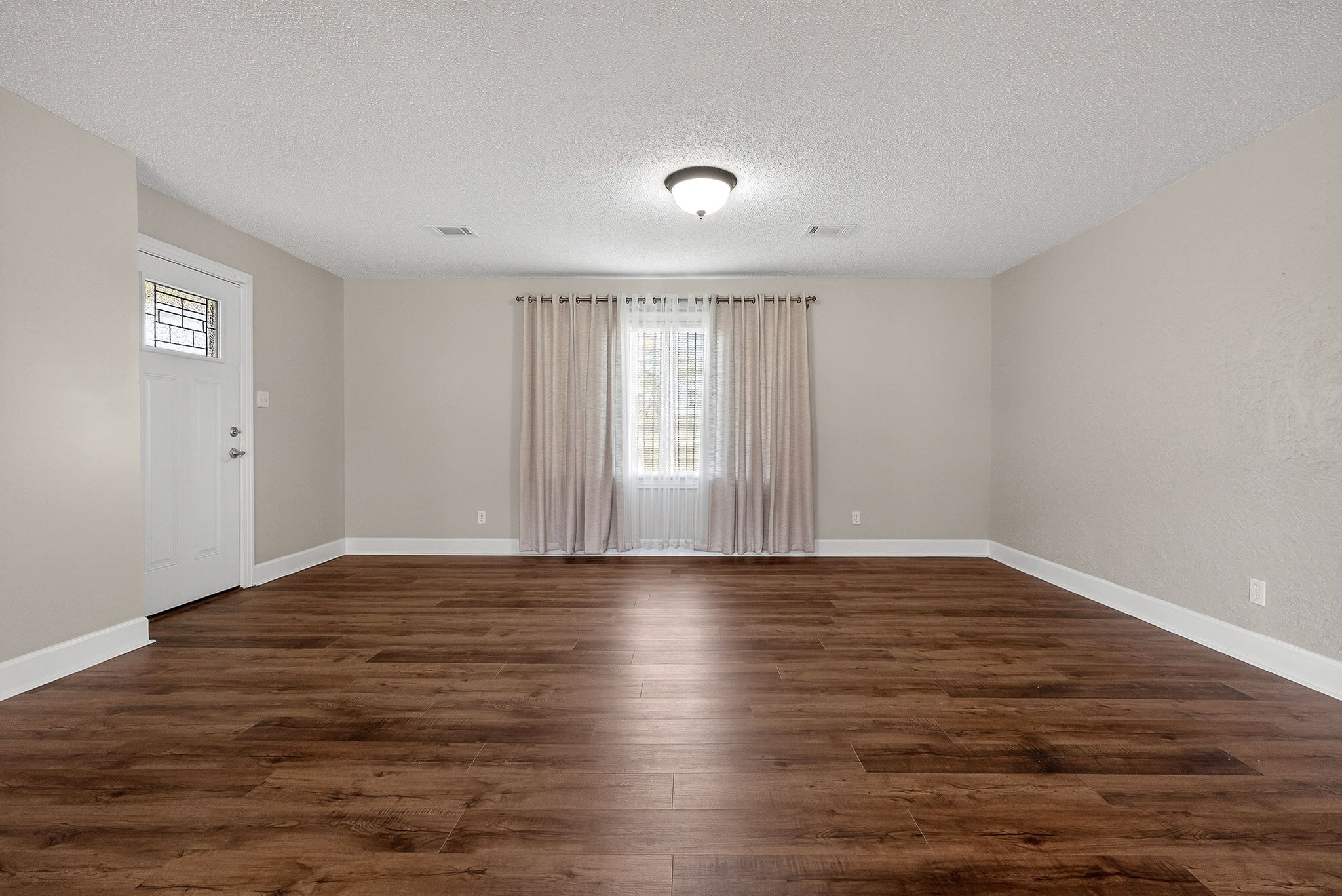 1003 Hodges Ferry Road Sparta, TN 38583 - Photo 10 of 49 a view of an empty room with wooden floor and window