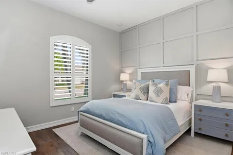 a bedroom with bed and window