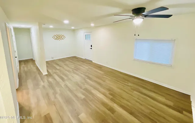 a view of a bathroom with a bathtub