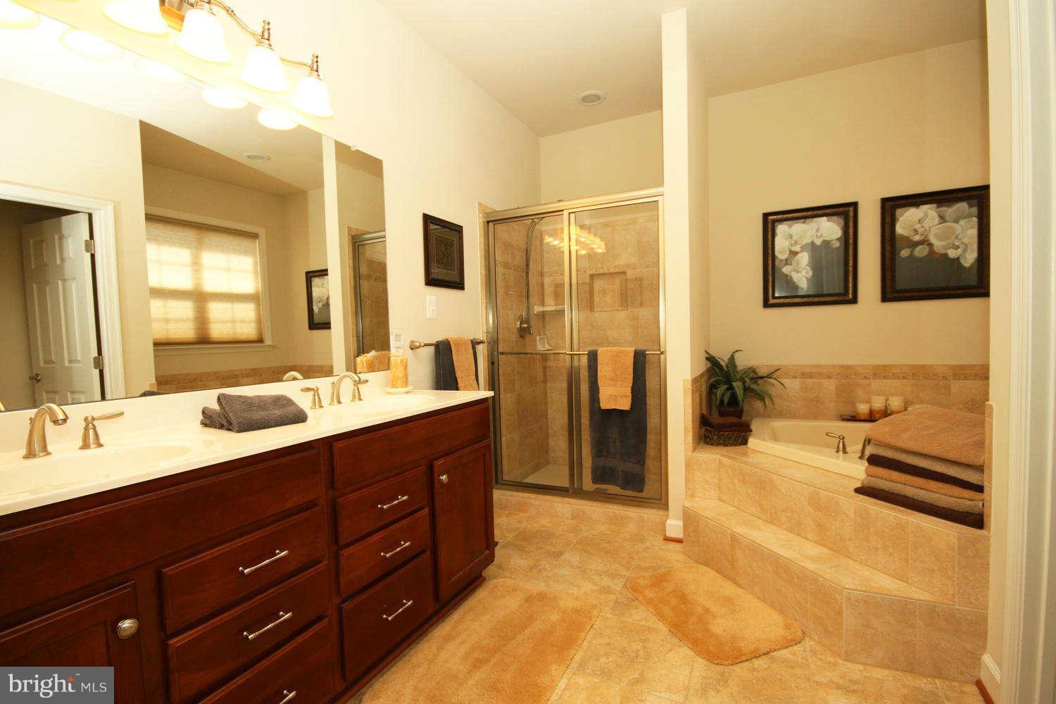 2 Sumantown Road Middletown, MD 21769 - Photo 13 of 30 a spacious bathroom with a granite countertop sink mirror and shower