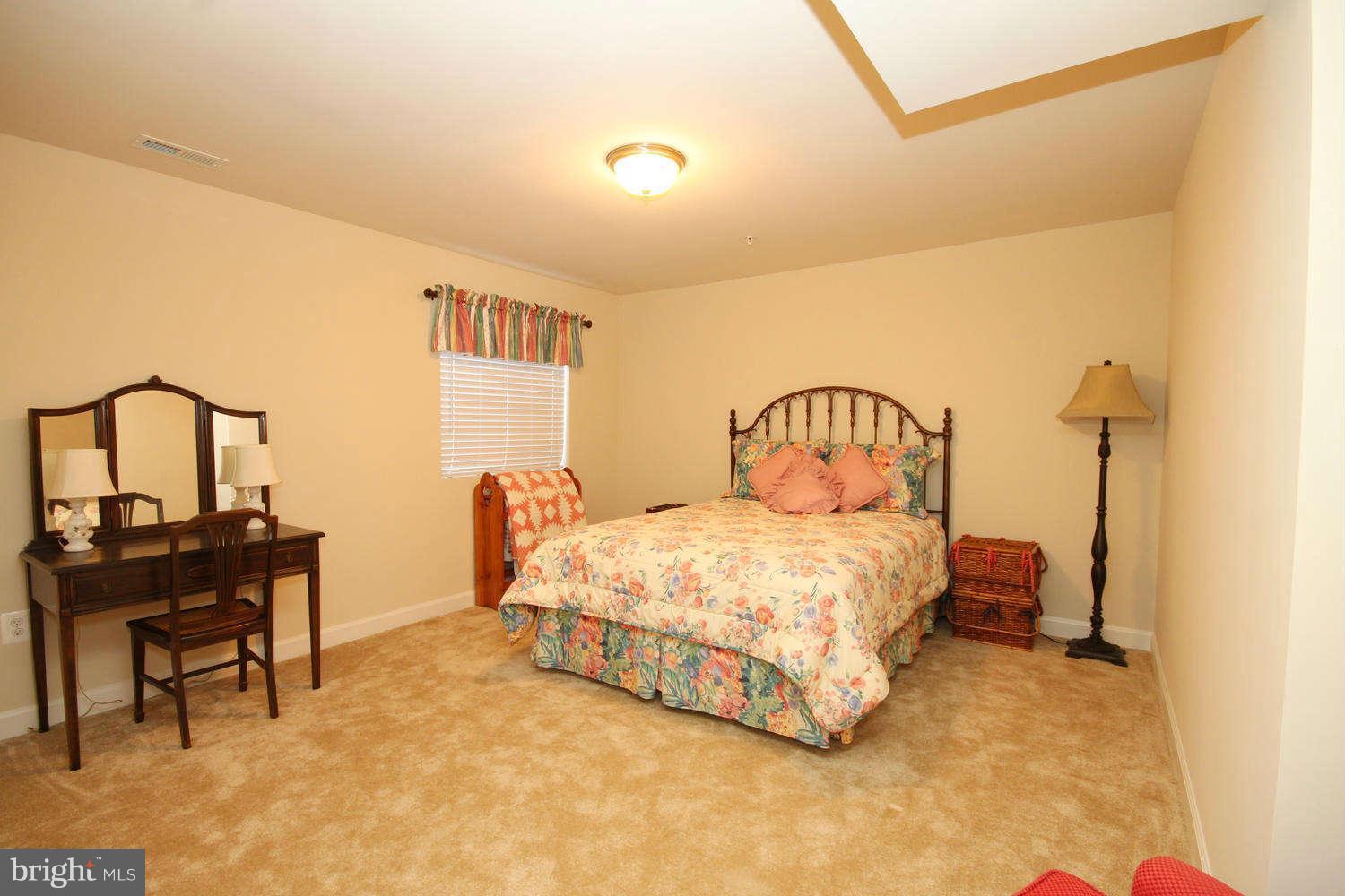 2 Sumantown Road Middletown, MD 21769 - Photo 24 of 30 a bedroom with a bed chair and a table