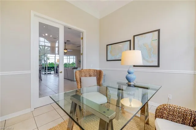a living room with furniture and a lamp