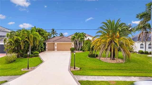 a view of a palm trees in front of a house