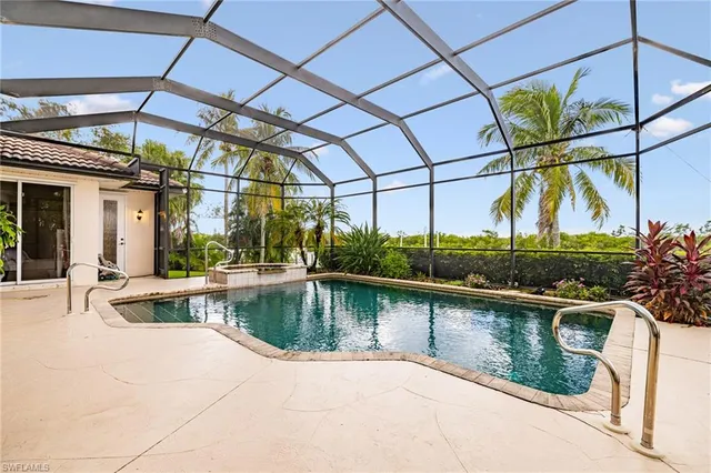 a view of a swimming pool with a patio
