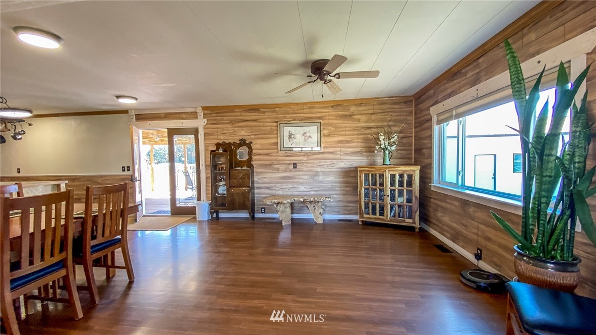 1787 East Lind Ralston Road Ritzville, WA 99169 - Photo 4 of 37 a view of an empty room with wooden floor and a window
