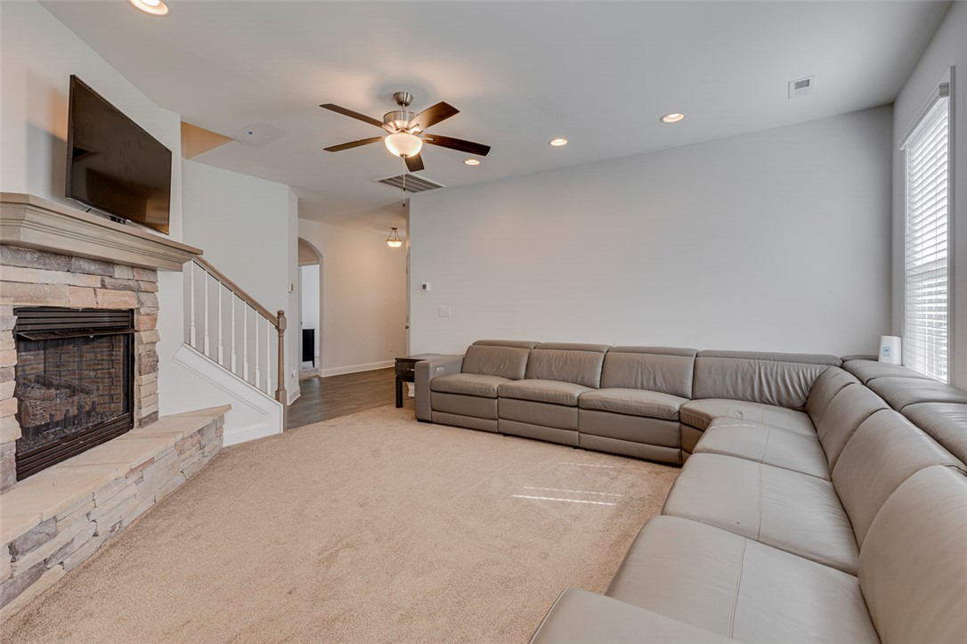 141 Capslock Trail Pendleton, SC 29670 - Photo 17 of 38 Warm and inviting living area features a stone-clad fireplace and plush carpet.