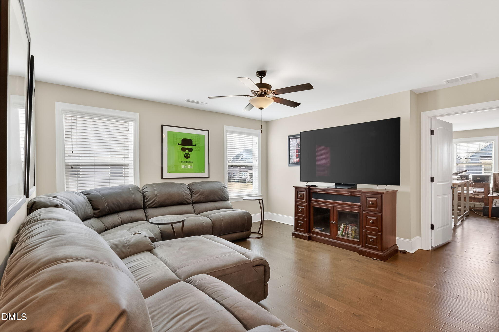 524 Dungannon Loop Clayton, NC 27520 - Photo 29 of 80 a living room with furniture and a flat screen tv