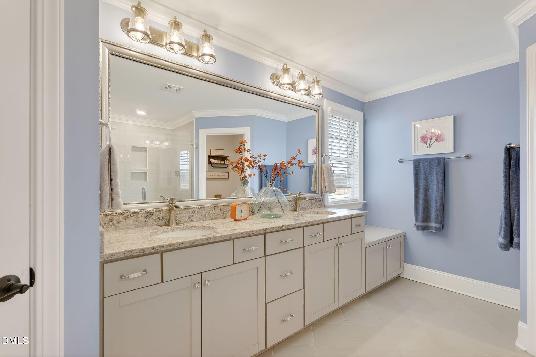 524 Dungannon Loop Clayton, NC 27520 - Photo 38 of 80 a bathroom with a double vanity sink and a mirror