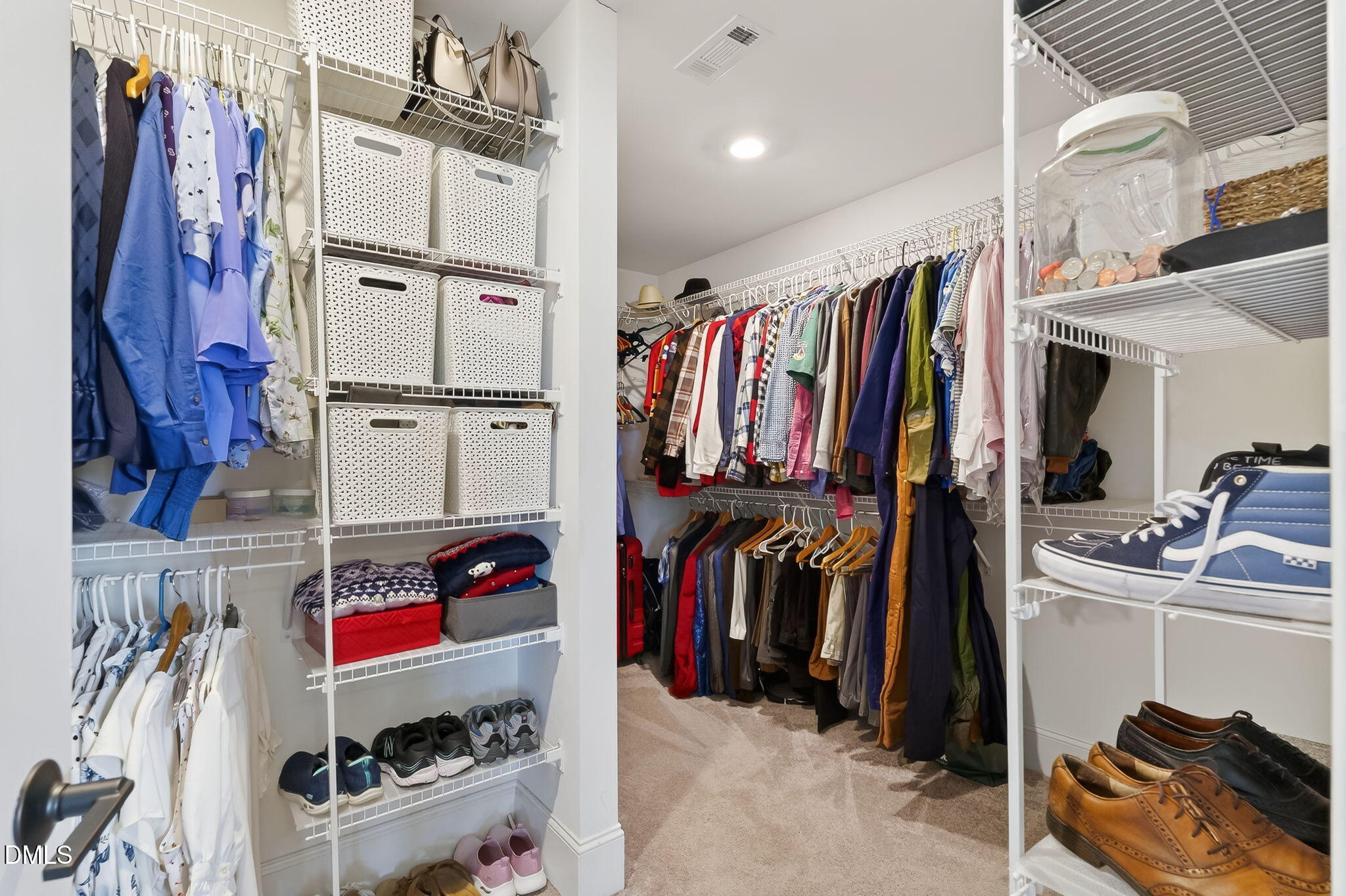 524 Dungannon Loop Clayton, NC 27520 - Photo 39 of 80 a view of walk in closet with clothes and shoes