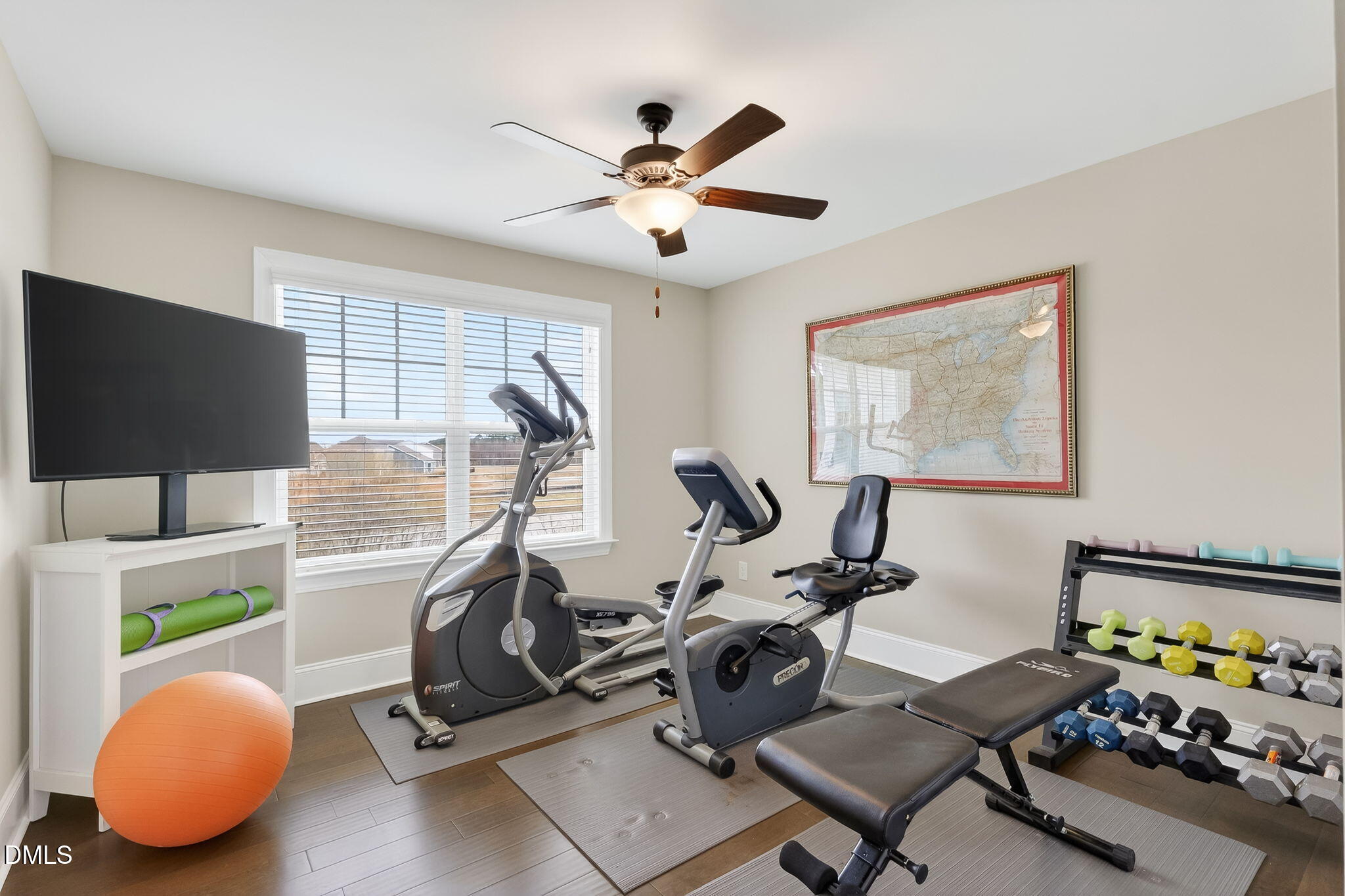 524 Dungannon Loop Clayton, NC 27520 - Photo 40 of 80 a room with gym equipment and a window