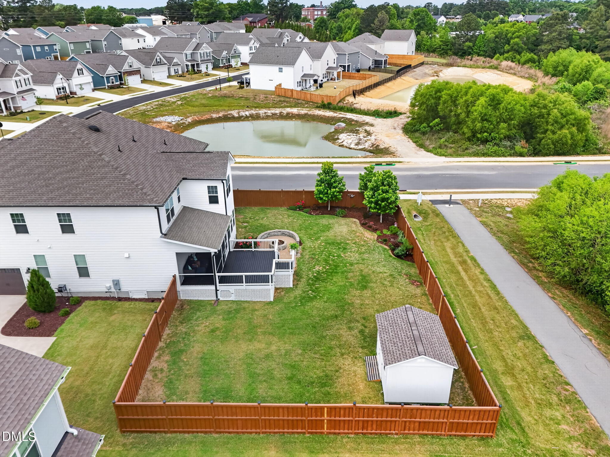 524 Dungannon Loop Clayton, NC 27520 - Photo 55 of 80 a view of a swimming pool with a lounge chairs