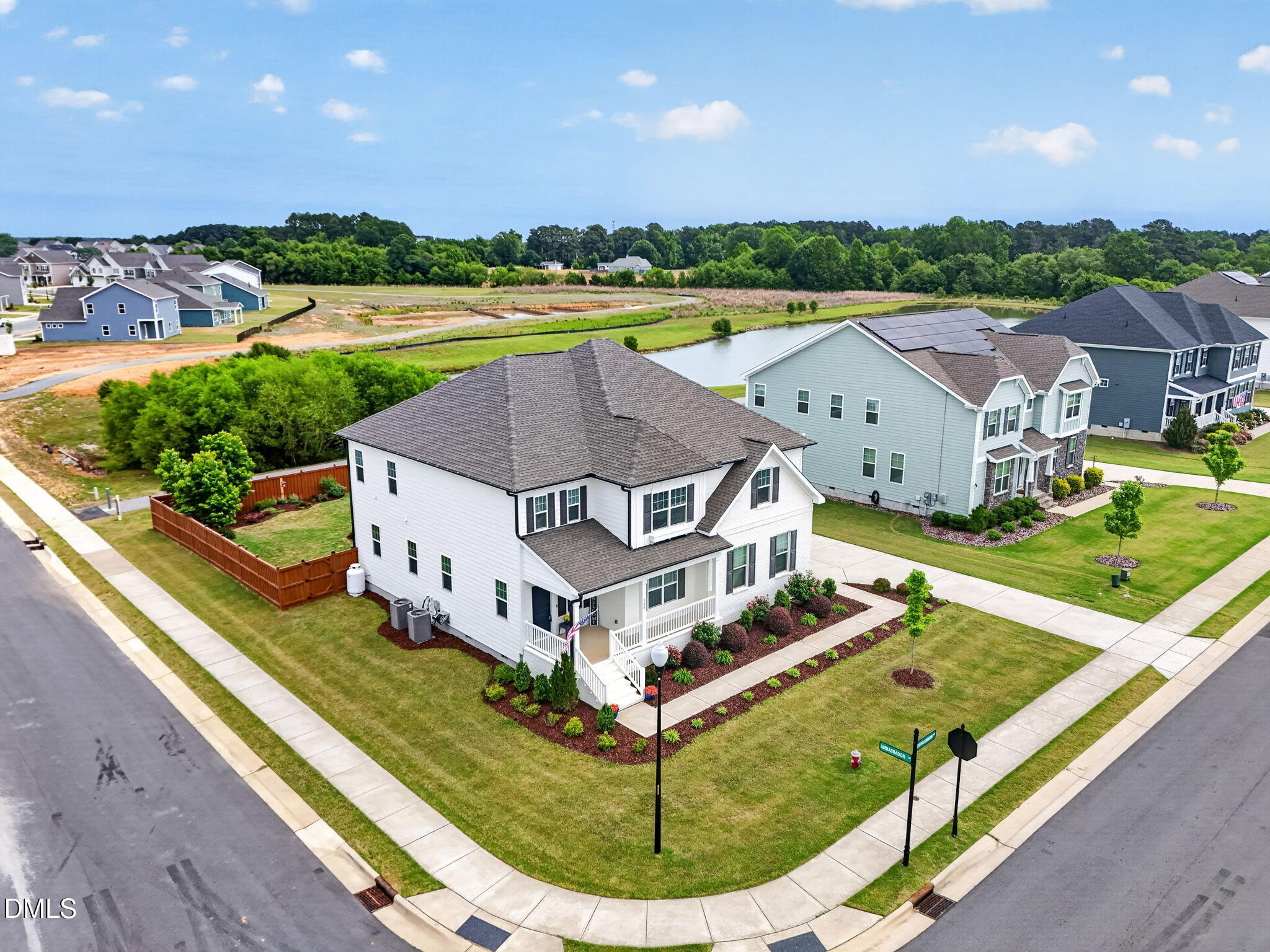 524 Dungannon Loop Clayton, NC 27520 - Photo 57 of 80 a aerial view of a house with a big yard and large trees
