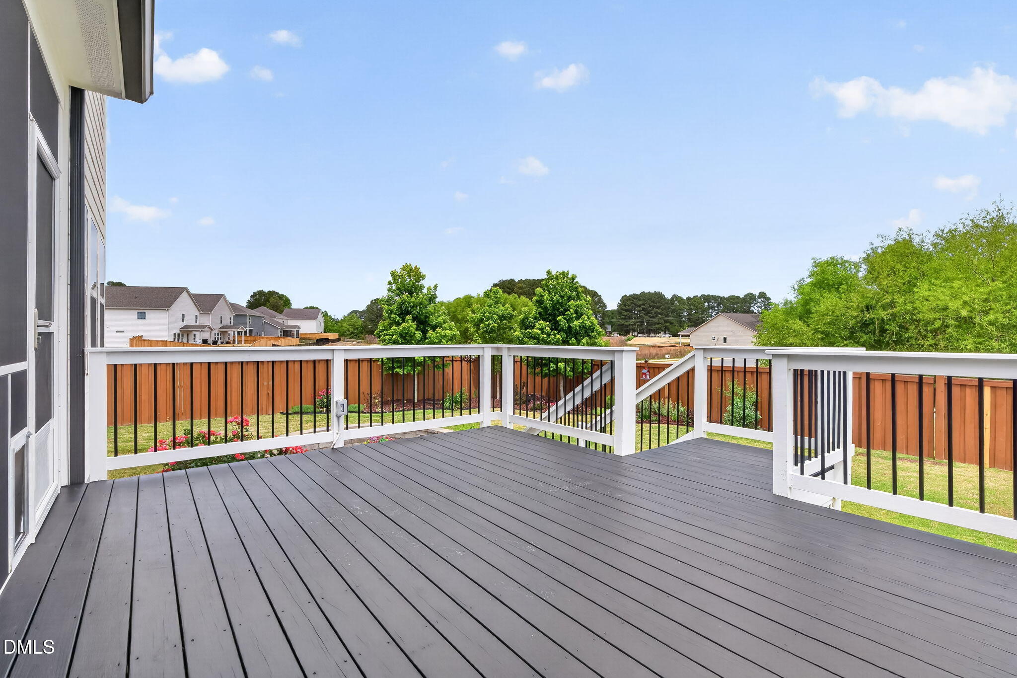524 Dungannon Loop Clayton, NC 27520 - Photo 72 of 80 a view of deck with wooden floor and fence with a yard