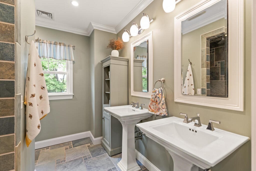 15 Millbrook Road Beverly, MA 01915 - Photo 19 of 32 a bathroom with a sink a toilet and a mirror
