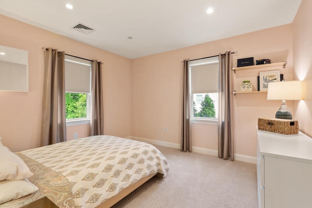 15 Millbrook Road Beverly, MA 01915 - Photo 20 of 32 a bedroom with a bed and a window