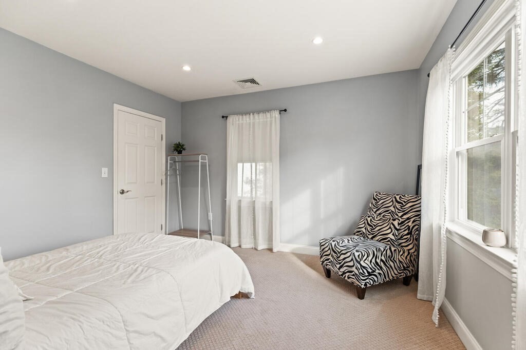 15 Millbrook Road Beverly, MA 01915 - Photo 21 of 32 a bedroom with a bed and a window