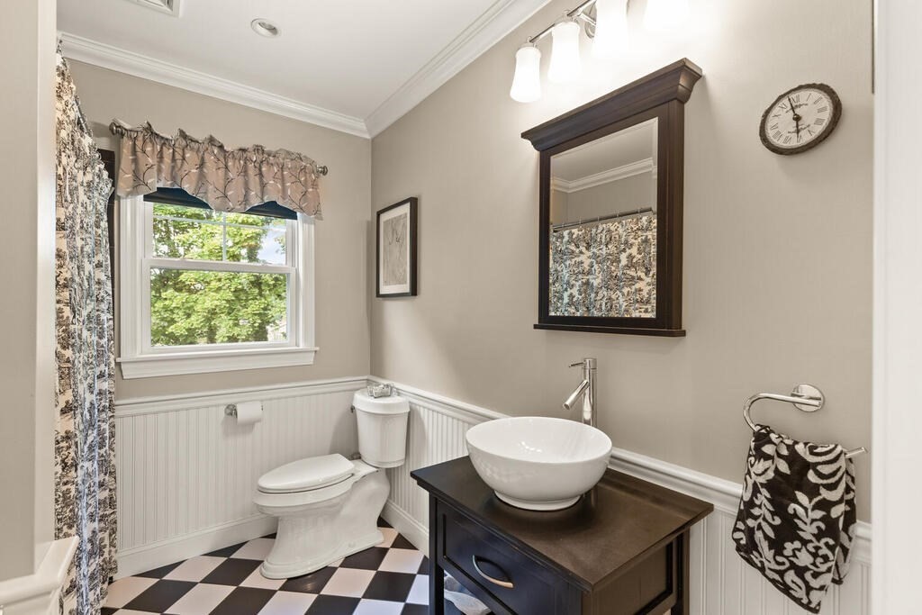 15 Millbrook Road Beverly, MA 01915 - Photo 22 of 32 a bathroom with a toilet a sink and a window