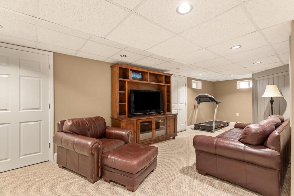15 Millbrook Road Beverly, MA 01915 - Photo 23 of 32 a living room with furniture and a flat screen tv