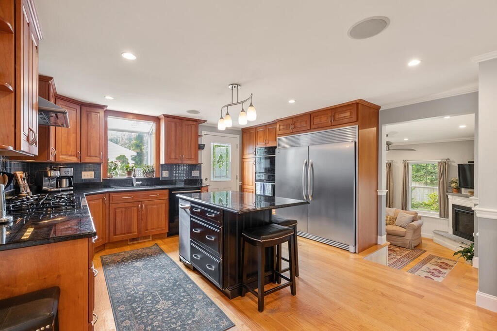 15 Millbrook Road Beverly, MA 01915 - Photo 6 of 32 a kitchen with stainless steel appliances granite countertop a refrigerator a stove and a sink with granite countertops