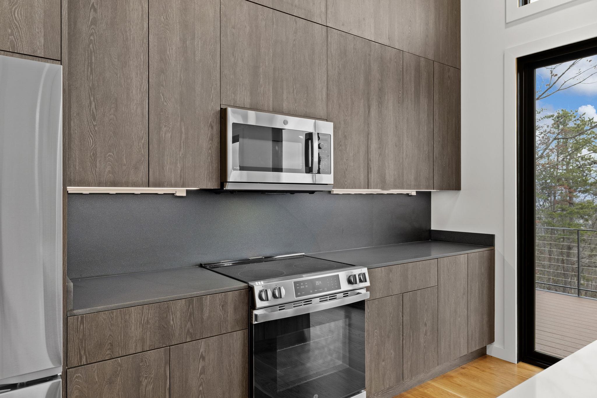 132 Holly Hl Road Luray, VA 22835 - Photo 12 of 69 a kitchen with stainless steel appliances wooden cabinets and a counter top