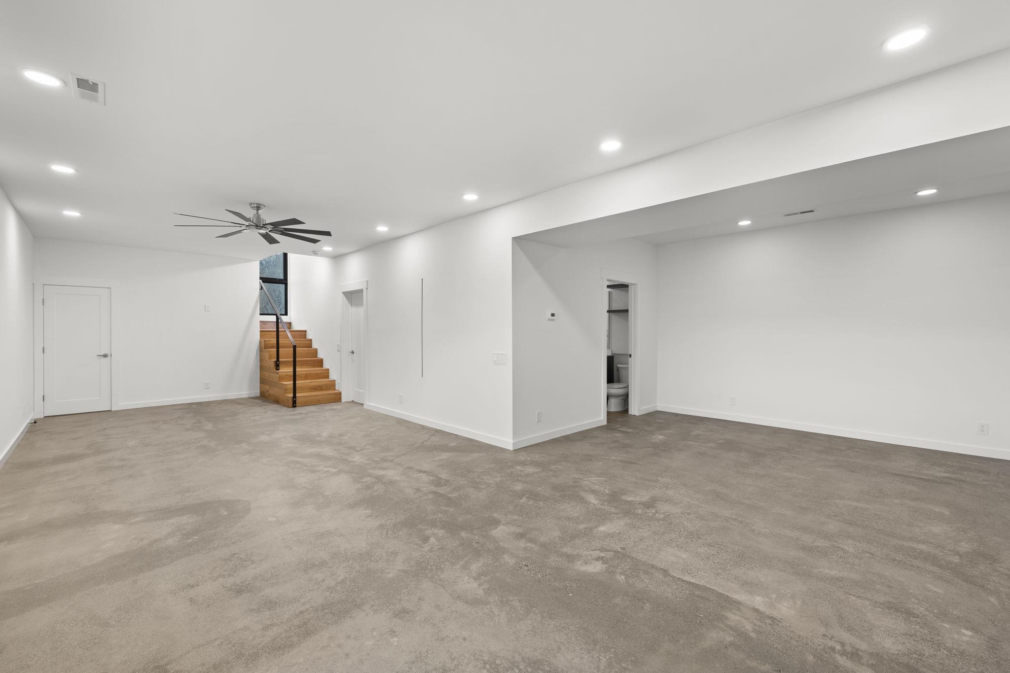 132 Holly Hl Road Luray, VA 22835 - Photo 38 of 69 a view of a livingroom with a staircase and a ceiling fan