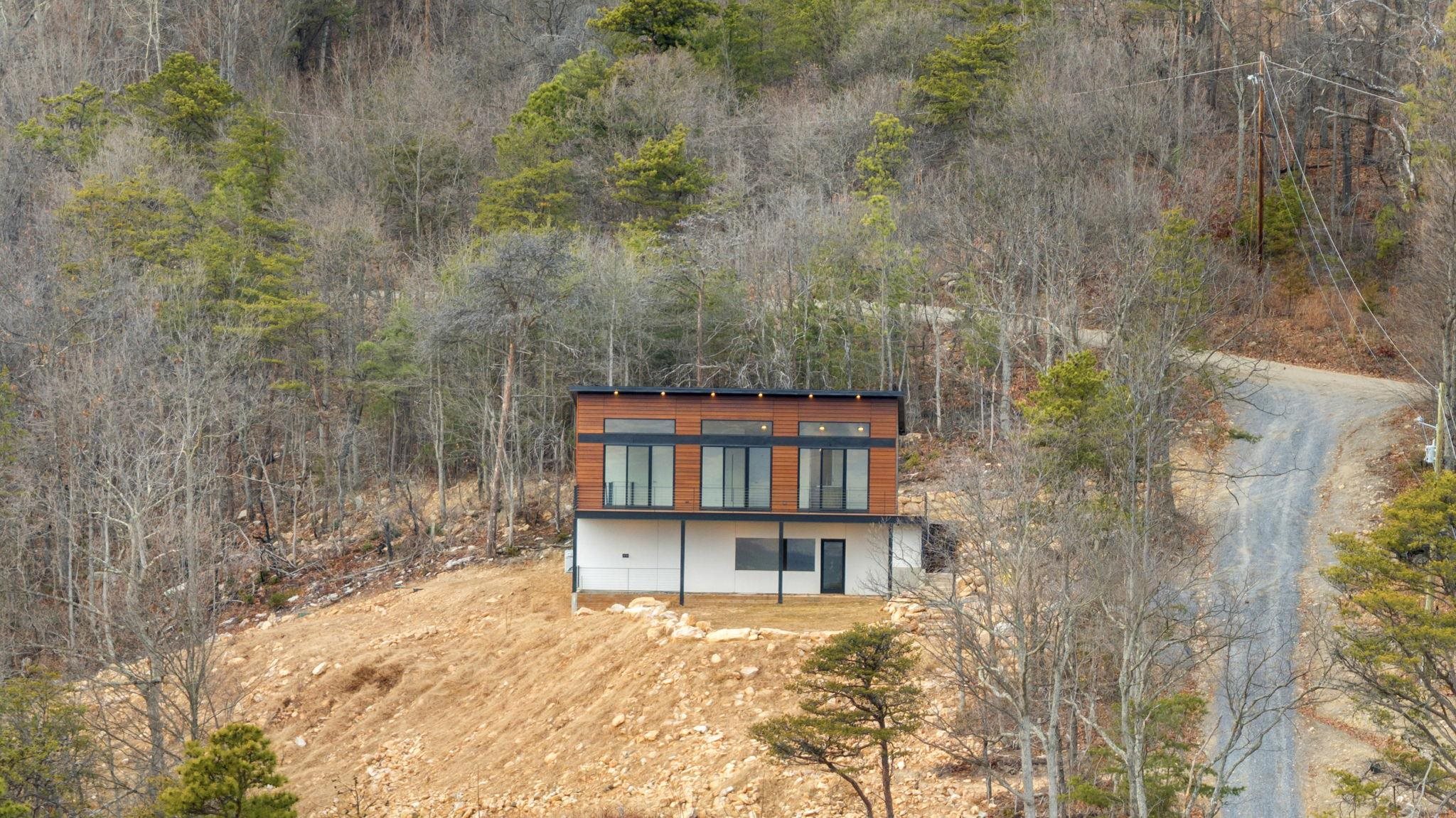 132 Holly Hl Road Luray, VA 22835 - Photo 52 of 69 a backyard of a house with large trees and plants