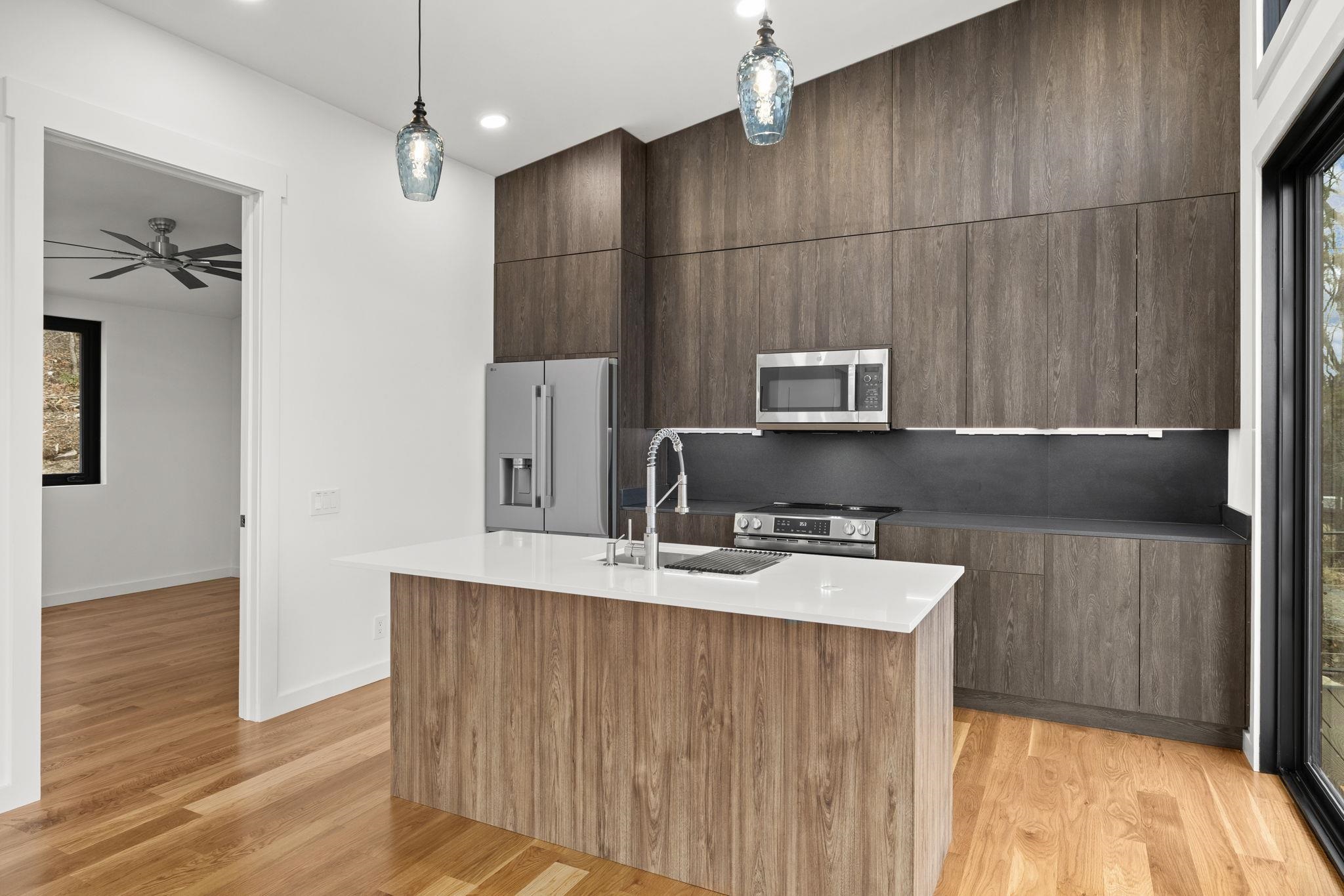 132 Holly Hl Road Luray, VA 22835 - Photo 10 of 69 a kitchen with kitchen island a sink appliances and cabinets