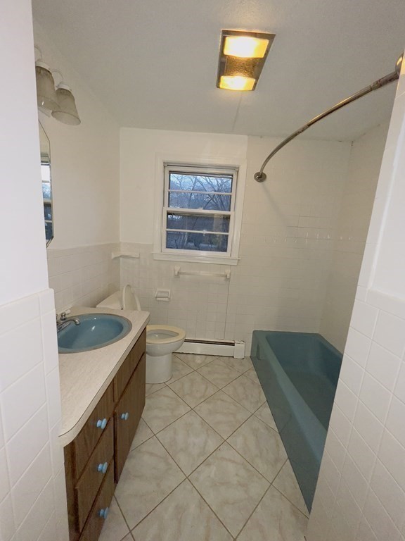 40 Michael Drive Brockton, MA 02301 - Photo 12 of 22 a bathroom with a sink a toilet and a shower