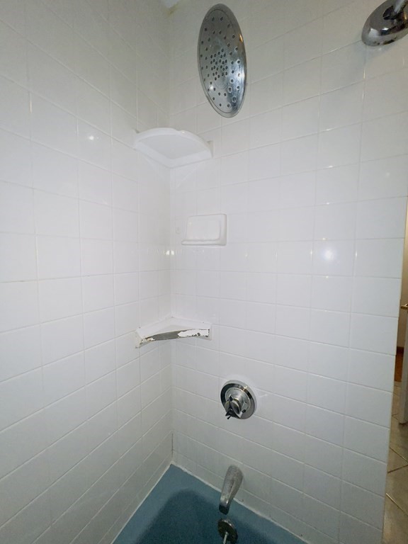 40 Michael Drive Brockton, MA 02301 - Photo 14 of 22 an empty room with a fan