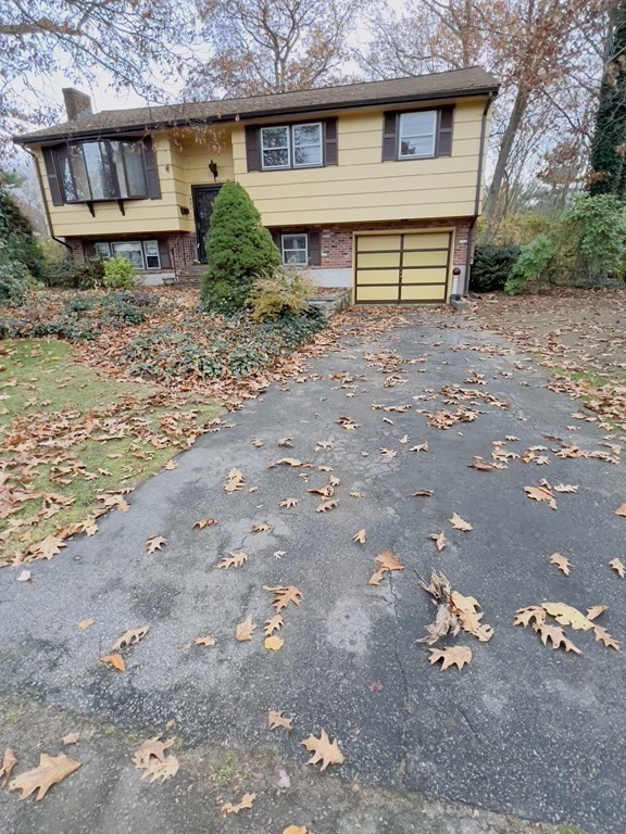 40 Michael Drive Brockton, MA 02301 - Photo 2 of 22 a front view of a house with a yard