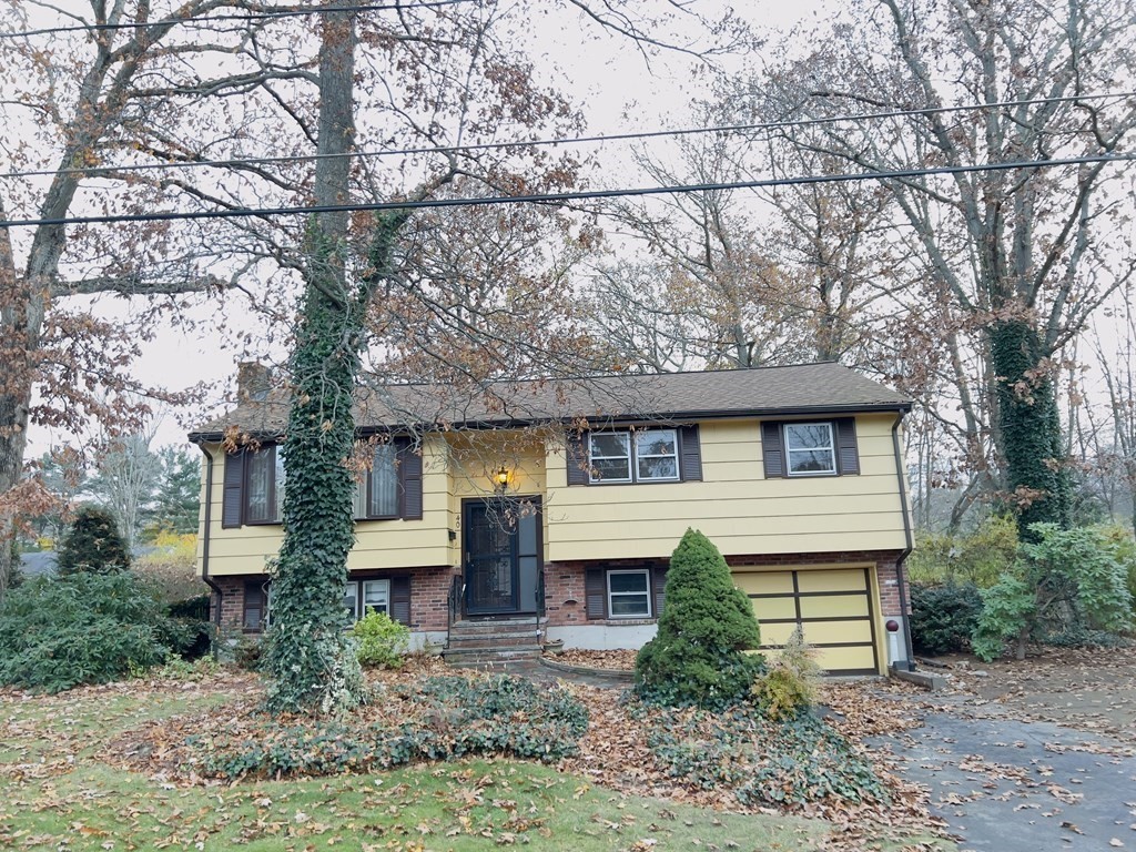 40 Michael Drive Brockton, MA 02301 - Photo 3 of 22 a front view of a house with garden