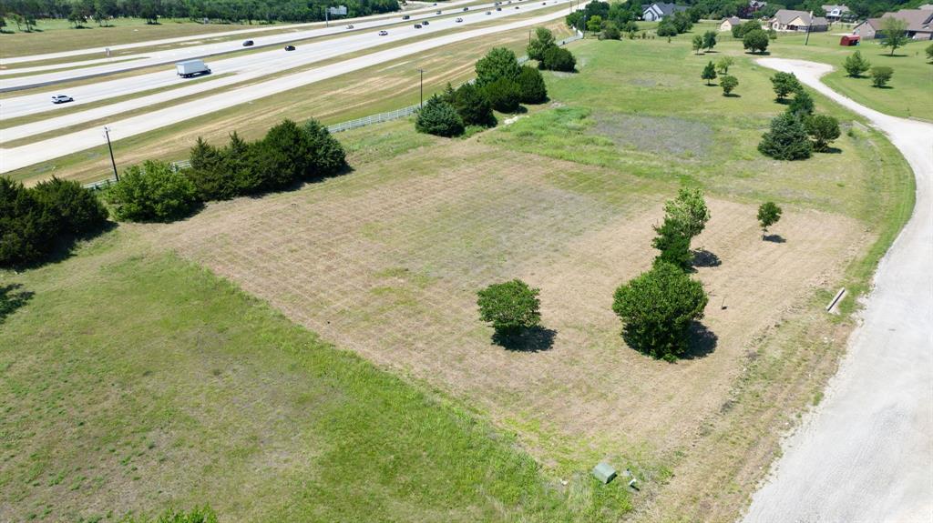 91 Country Rdg Road Melissa, TX 75454 - Photo 6 of 18 a view of a yard with yellow plants